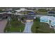 Waterfront home with landscaped yard, private dock, boat lift and decorative driveway at 8178 Arlewood Cir, Port Charlotte, FL 33981