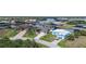 An aerial view of the community with waterfront homes and lush landscaping along the canals at 8178 Arlewood Cir, Port Charlotte, FL 33981