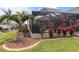 Well-kept backyard featuring a screened-in pool and lush tropical landscaping, perfect for relaxing at 8178 Arlewood Cir, Port Charlotte, FL 33981