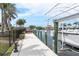 Private boat dock featuring a boat lift and waterfront views at 8178 Arlewood Cir, Port Charlotte, FL 33981