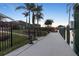 Dock with green landscaping, canal and space for seating at 8178 Arlewood Cir, Port Charlotte, FL 33981
