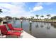Lounge on the dock with beautiful views of the serene canal at 8178 Arlewood Cir, Port Charlotte, FL 33981