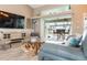 Cozy living room overlooking the pool, featuring stylish decor and comfortable seating arrangements at 8178 Arlewood Cir, Port Charlotte, FL 33981