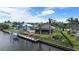 Wonderful waterfront home featuring a private dock, boat lift and well-manicured backyard at 8178 Arlewood Cir, Port Charlotte, FL 33981