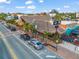 The outdoor bar and restaurant with a thatched roof is surrounded by palm trees, and neighborhood shops at 915 Beach Rd # 215, Siesta Key, FL 34242