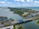 Breathtaking aerial view of a bridge with surrounding coastline and blue ocean waters at 915 Beach Rd # 215, Siesta Key, FL 34242