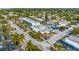 An aerial view that captures the street of commercial buildings, lush landscaping and inviting storefronts at 915 Beach Rd # 215, Siesta Key, FL 34242