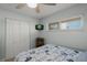 This bedroom has a ceiling fan, closet, small TV and a window with blinds for privacy at 915 Beach Rd # 215, Siesta Key, FL 34242