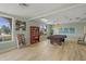 Spacious community billiard room with a pool table, shelving, and comfortable seating area at 915 Beach Rd # 215, Siesta Key, FL 34242