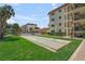 Community features a shuffleboard court, pool, and lush landscaping for outdoor enjoyment at 915 Beach Rd # 215, Siesta Key, FL 34242