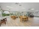 Inviting community room with seating, tables, reception desk, and large windows for natural light at 915 Beach Rd # 215, Siesta Key, FL 34242