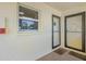 Apartment front entrance with welcome mats and unit numbers at 915 Beach Rd # 215, Siesta Key, FL 34242
