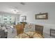 Bright living room and dining area with stylish decor, access to the balcony, and ample natural light at 915 Beach Rd # 215, Siesta Key, FL 34242
