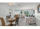 Inviting living room and dining area with access to the balcony, perfect for relaxing and entertaining at 915 Beach Rd # 215, Siesta Key, FL 34242