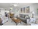 Open concept living room and dining area with comfortable furnishings at 915 Beach Rd # 215, Siesta Key, FL 34242