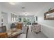 Cozy living room with comfortable seating, access to the balcony, and serene decor for a relaxing ambiance at 915 Beach Rd # 215, Siesta Key, FL 34242