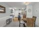 Dining area and kitchen with stainless steel appliances in a home with an open concept and plenty of light at 915 Beach Rd # 215, Siesta Key, FL 34242