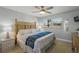 Comfortable main bedroom with bright window, side tables and two lamps at 915 Beach Rd # 215, Siesta Key, FL 34242