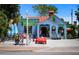 Unique shop exterior with a bright blue façade, surfboards, and rental vehicles at 915 Beach Rd # 215, Siesta Key, FL 34242