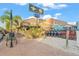 Charming tiki bar with a thatched roof offers a fun island vibe near the beach, scooters, and bikes at 915 Beach Rd # 215, Siesta Key, FL 34242