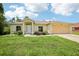 Beautiful single-story home with a well-kept lawn, attached two car garage, and inviting front doorway at 5260 Jessamine Ave, North Port, FL 34291