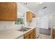Kitchen featuring a stainless steel sink, wood cabinets, and plenty of natural light at 5260 Jessamine Ave, North Port, FL 34291