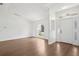 Bright living room with sleek wood floors, large windows, and a modern, neutral color palette at 5260 Jessamine Ave, North Port, FL 34291