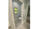 Clean bathroom with toilet and tiled floor at 124 Hercules Dr, Rotonda West, FL 33947
