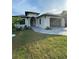 Modern home with attached garage and landscaped front yard at 124 Hercules Dr, Rotonda West, FL 33947