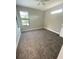 Spacious bedroom with carpeted floor and window at 124 Hercules Dr, Rotonda West, FL 33947