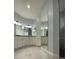 Spacious bathroom with double vanity and large mirror at 124 Hercules Dr, Rotonda West, FL 33947