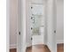 The primary bathroom has tile floors, a glass enclosed shower, and white cabinets at 10009 Gasparilla Pass Blvd, Boca Grande, FL 33921