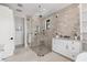 The primary bathroom has tile floors, a glass enclosed shower, and white cabinets at 10009 Gasparilla Pass Blvd, Boca Grande, FL 33921