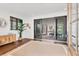 Bright foyer with hardwood floors, decorative rug, and views of outdoor pool via sliding doors at 10009 Gasparilla Pass Blvd, Boca Grande, FL 33921