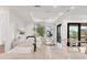 Spacious kitchen island with seating, white countertops, a sink, and modern design, great for Gathering gatherings at 10009 Gasparilla Pass Blvd, Boca Grande, FL 33921