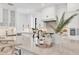 Modern kitchen with white cabinets, stainless steel appliances, and marble countertops at 10009 Gasparilla Pass Blvd, Boca Grande, FL 33921