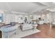 Spacious open-concept layout with hardwood floors, connecting the living room, dining area, and kitchen at 10009 Gasparilla Pass Blvd, Boca Grande, FL 33921