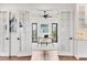 Home office with French doors and built-in cabinets at 10009 Gasparilla Pass Blvd, Boca Grande, FL 33921