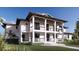 Two-story home with a large front porch and classic design at 10009 Gasparilla Pass Blvd, Boca Grande, FL 33921