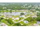 Aerial view of community with lake and houses at 256 Coblentz St, Port Charlotte, FL 33954