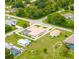Aerial view of house, pool, and detached garage at 256 Coblentz St, Port Charlotte, FL 33954