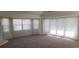 Bedroom featuring neutral carpet, plenty of natural light, and neutral paint at 443 Madrid Blvd, Punta Gorda, FL 33950