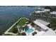 Community pool and patio area with waterfront views and lush landscaping at 11000 Placida Rd # 1801, Placida, FL 33946