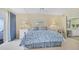 Spacious bedroom with a floral comforter and ensuite bathroom access at 11000 Placida Rd # 1801, Placida, FL 33946