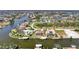 Aerial view showcasing a canal front home at 15706 Viscount Cir, Port Charlotte, FL 33981