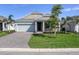 New single-Gathering home with gray siding and stone accents at 16824 Canopy Garden Dr, Port Charlotte, FL 33953