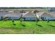 Aerial view of homes with screened patios and green lawns at 16824 Canopy Garden Dr, Port Charlotte, FL 33953