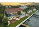 Stunning waterfront property boasts a pool, dock, and captivating sunset views at 8035 Manasota Key Rd, Englewood, FL 34223