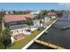 Aerial view of waterfront home with private dock and pool at 8035 Manasota Key Rd, Englewood, FL 34223