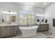 Elegant bathroom with freestanding tub and chandelier at 8035 Manasota Key Rd, Englewood, FL 34223